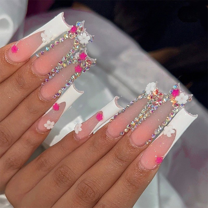 Glamorous artificial nail set with sparkling rhinestones and cross decorations Bowlift