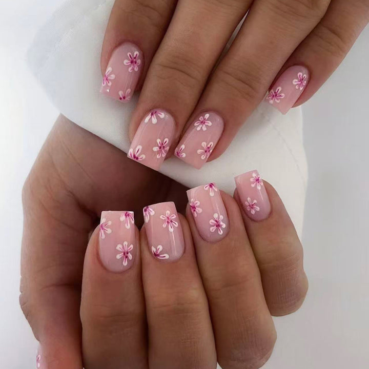 Artful Nail Art with Flower Design and Blue French Tip Bowlift
