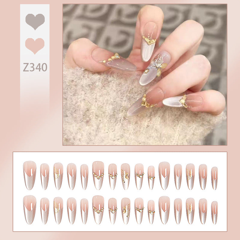 Glamorous art nails with elegant golden details Bowlift