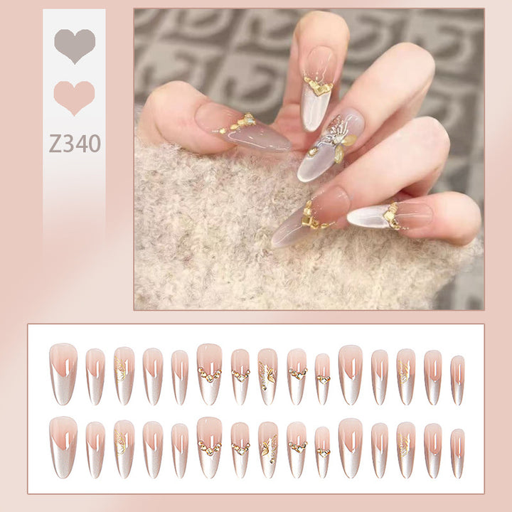 Glamorous art nails with elegant golden details Bowlift