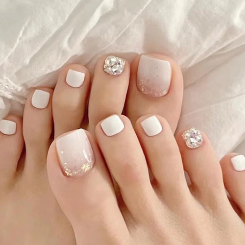 Artful toenail design with sparkling embellishments Bowlift