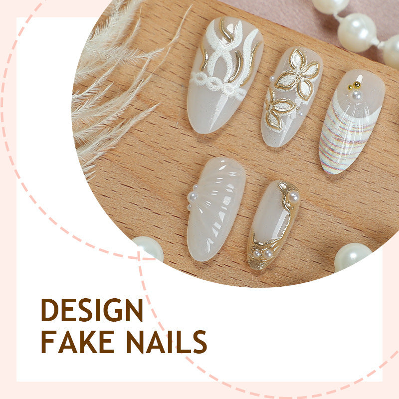 Artificial nail set with luxurious gold embellishments and elegant natural motifs Bowlift