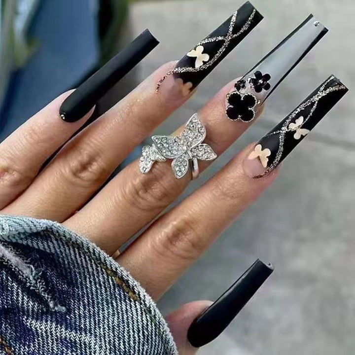Art nail set with elegant butterfly and flower motifs Bowlift