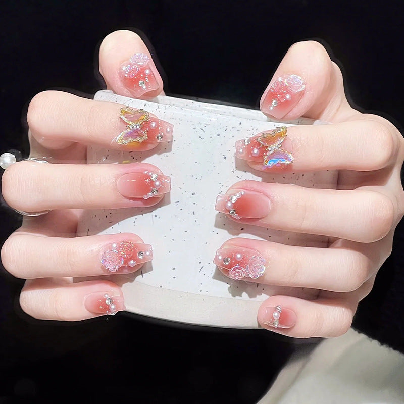 Glamorous artificial nails with delicate flower and glitter effects Bowlift