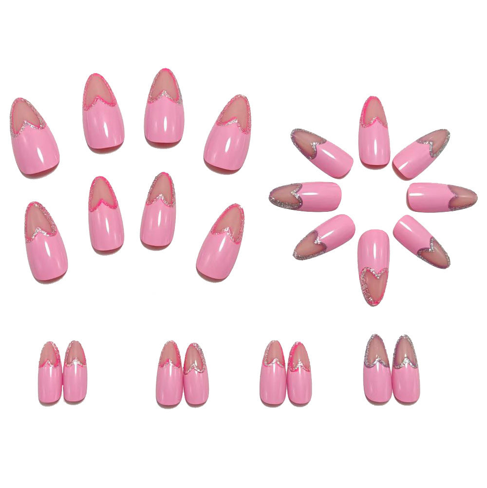 Art nails with heart design and glitter accents Bowlift