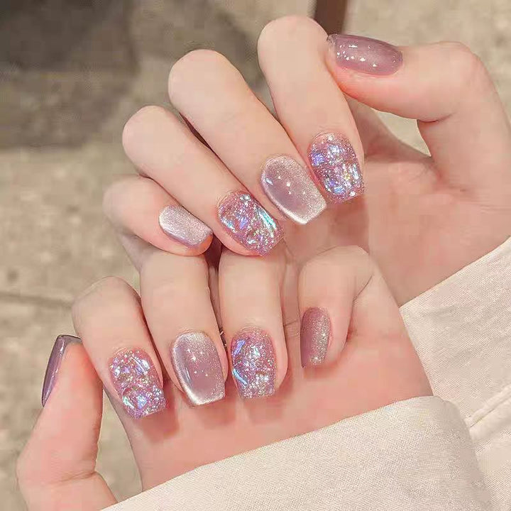 Artificial nails with elegant ombre effect and glitter coating Bowlift