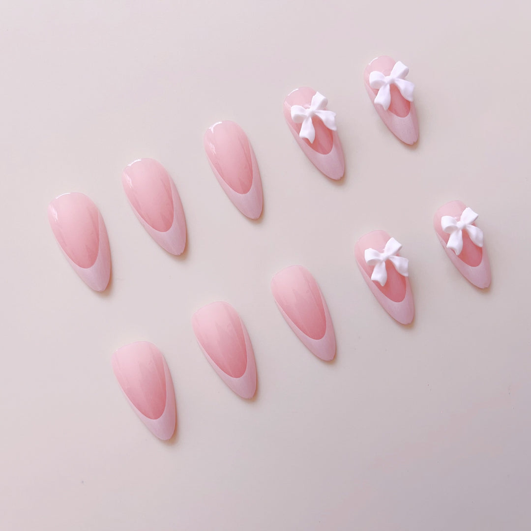 Artificial nail set with elegant tips and delicate bow decorations Bowlift