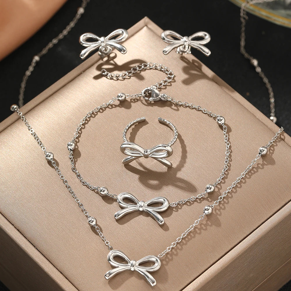 BowLift | Feminine Bow Satellite Chain Necklace, Bracelet, Earrings, and Ring Set