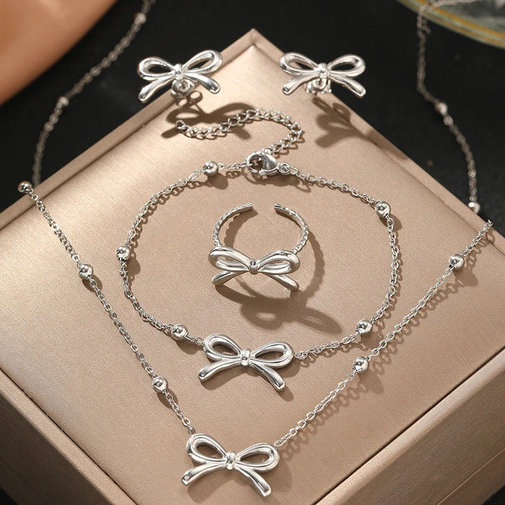 BowLift | Feminine Bow Satellite Chain Necklace, Bracelet, Earrings, and Ring Set