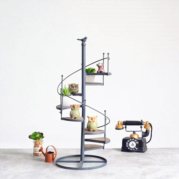 Elegant spiral-shaped plant stand for balcony and garden arrangements Bowlift