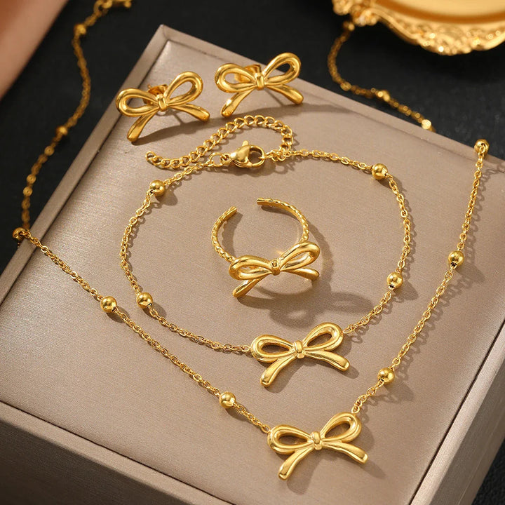 BowLift | Feminine Bow Satellite Chain Necklace, Bracelet, Earrings, and Ring Set