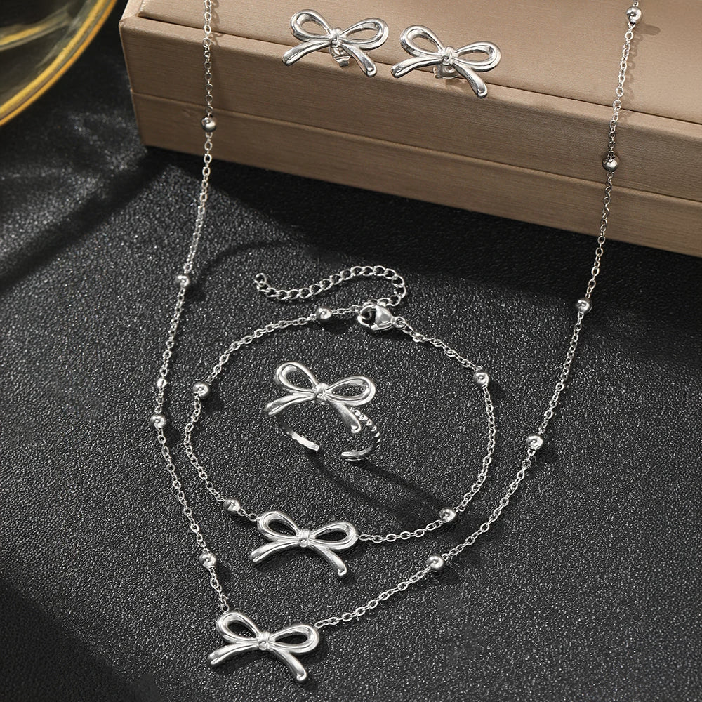 BowLift | Feminine Bow Satellite Chain Necklace, Bracelet, Earrings, and Ring Set