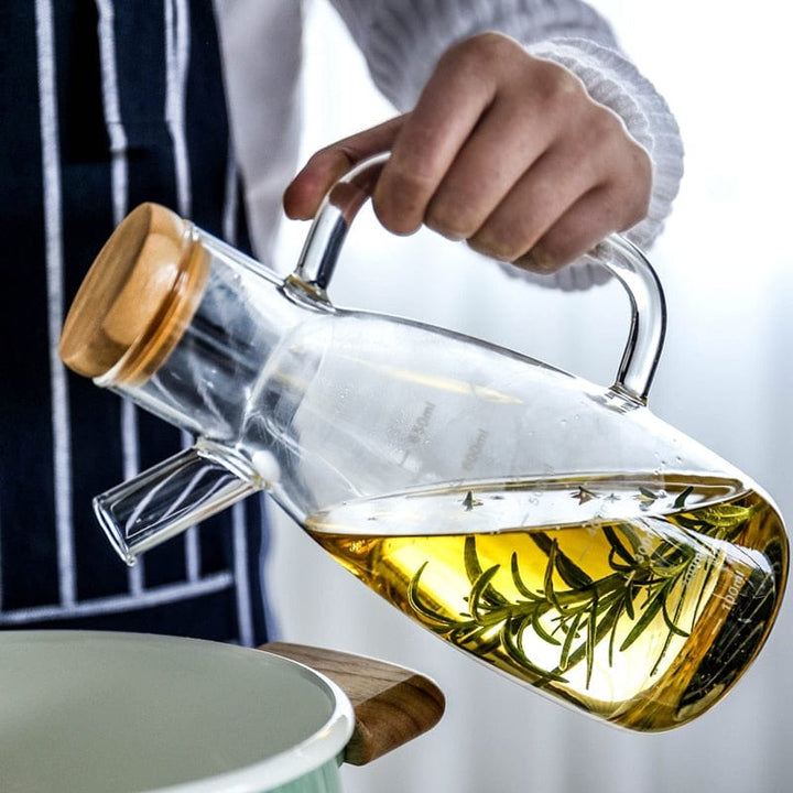 Transparent glass oil bottle with handle Bowlift
