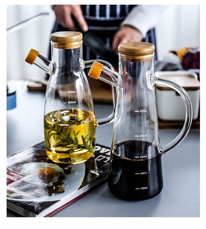 Transparent glass oil bottle with handle Bowlift