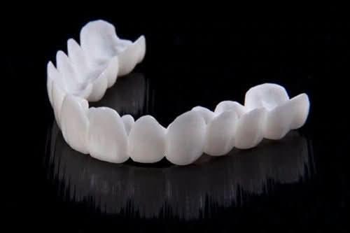 BowLift | Dental prosthesis with white dental lenses