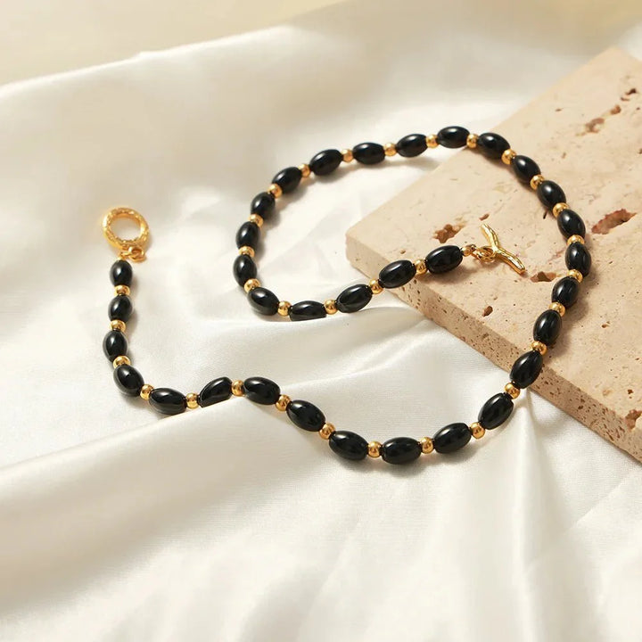 BowLift | Boho Beaded Black and Gold Circle Clasp Necklace