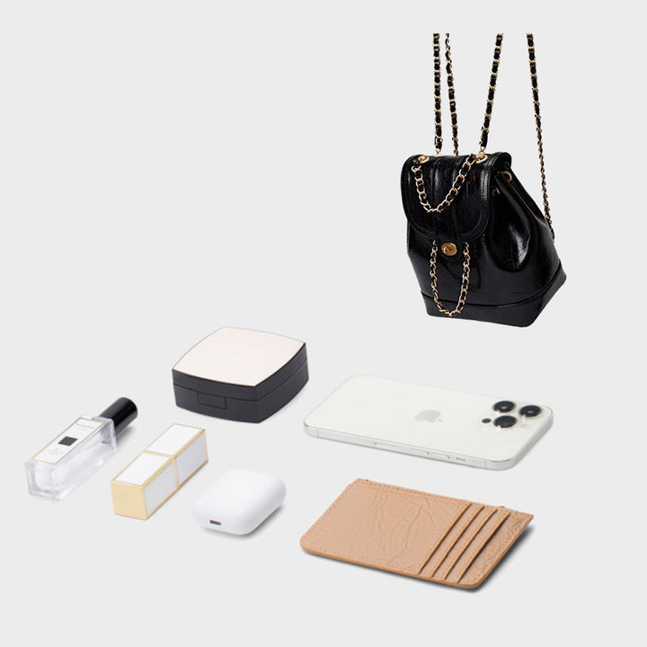 Compact backpack made of PU with chain decoration
