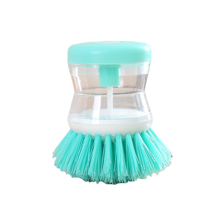 Dish brush with soap dispenser for pressing