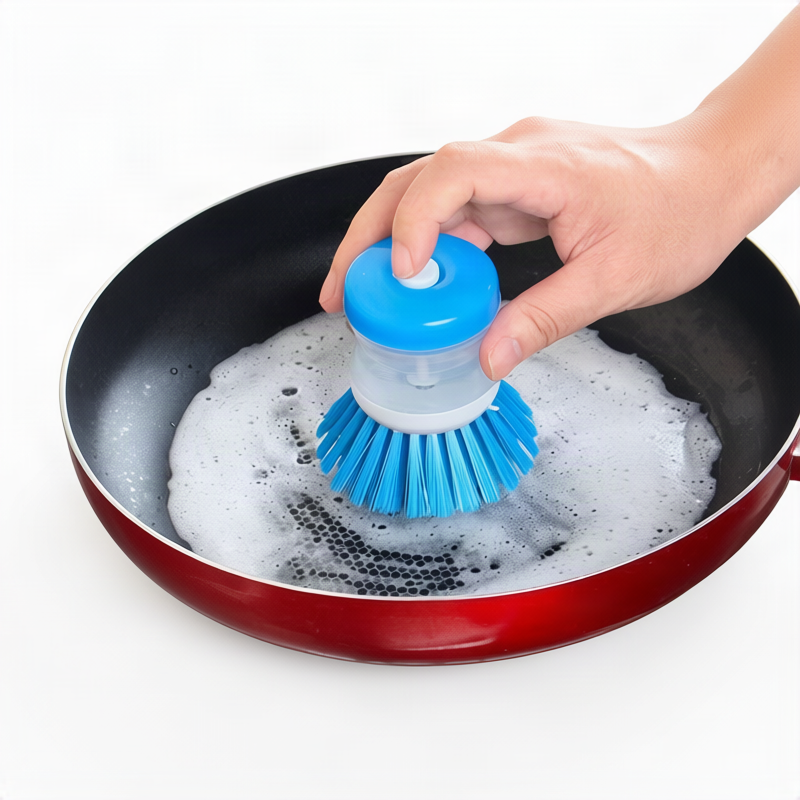 Dish brush with soap dispenser for pressing