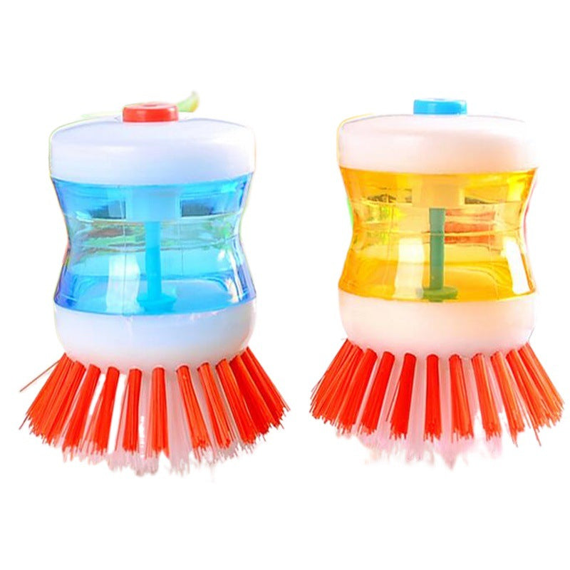 Dish brush with soap dispenser for pressing