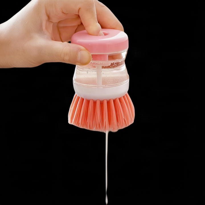 Dish brush with soap dispenser for pressing