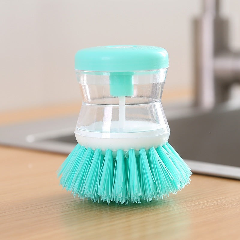 Dish brush with soap dispenser for pressing