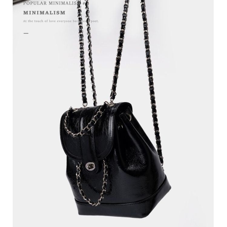 Compact backpack made of PU with chain decoration