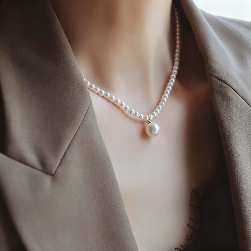Pearl necklace with silver clasp, pearls 4–12 mm