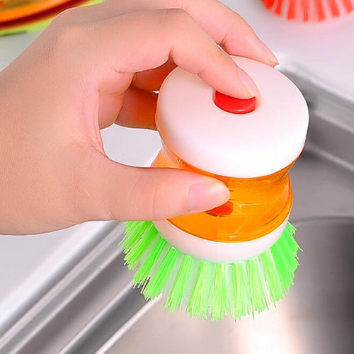 Dish brush with soap dispenser for pressing
