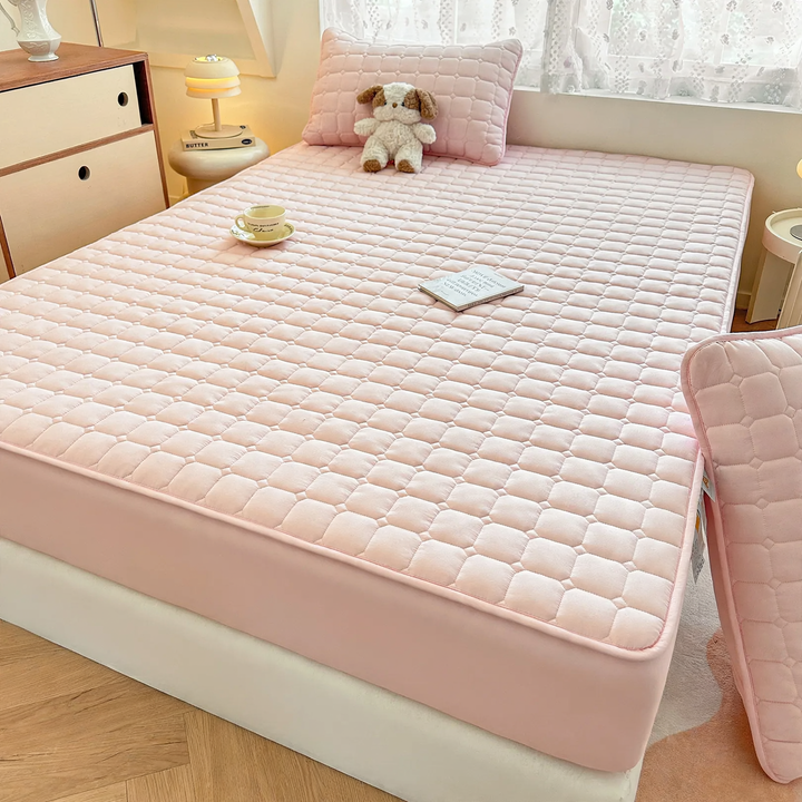 Waterproof mattress pad with quilting