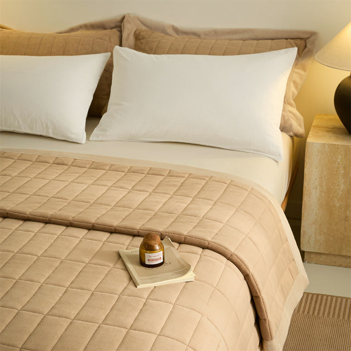Warming duvet made of milk fiber with stitching