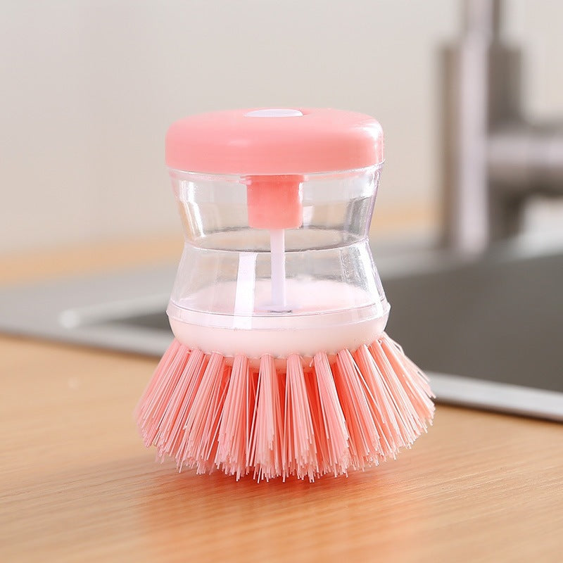 Dish brush with soap dispenser for pressing