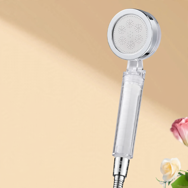 Hand shower with filter and pressure boost