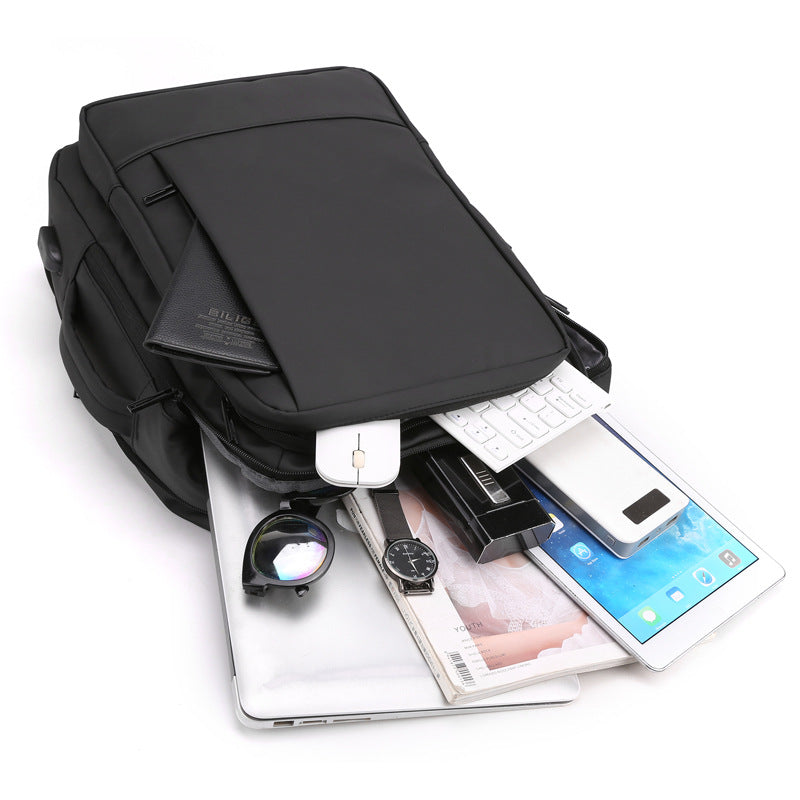 Expandable business backpack with USB charging, 20-35 L