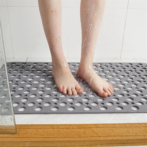Shower mat with suction cups and drainage holes | Bowlift