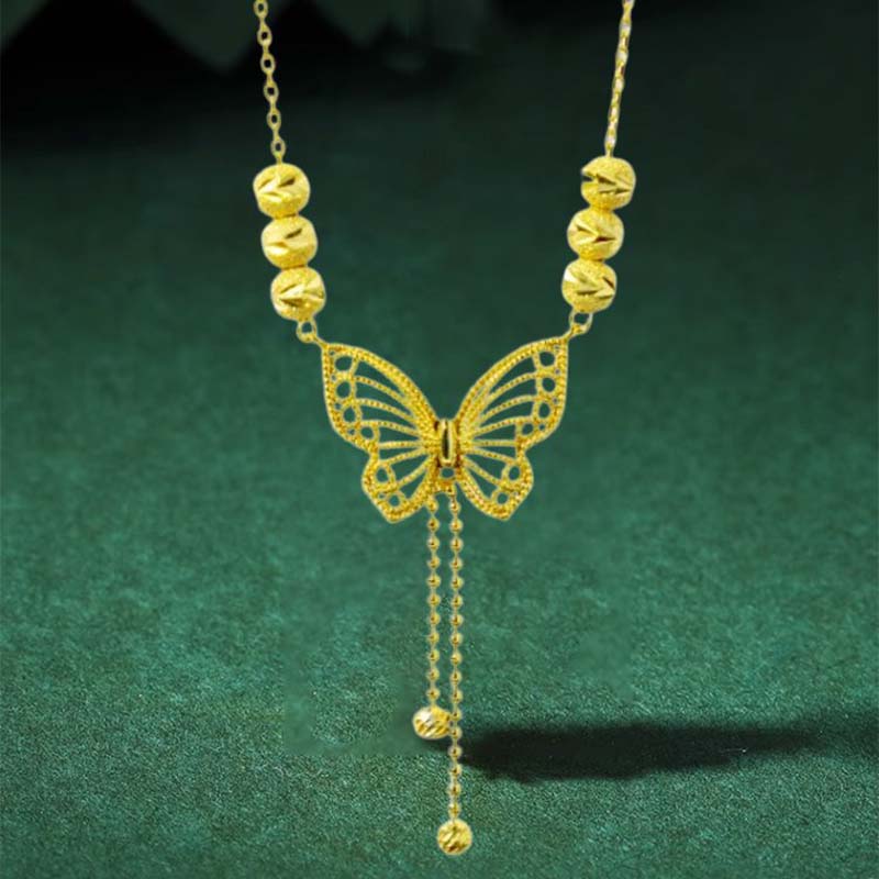 BowLift | Necklace with gold-colored butterfly with tassels