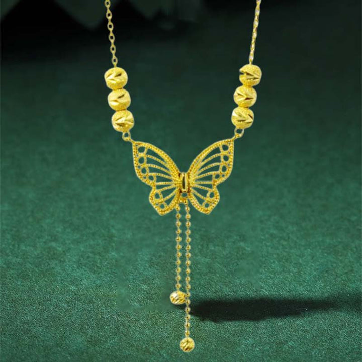 BowLift | Necklace with gold-colored butterfly with tassels