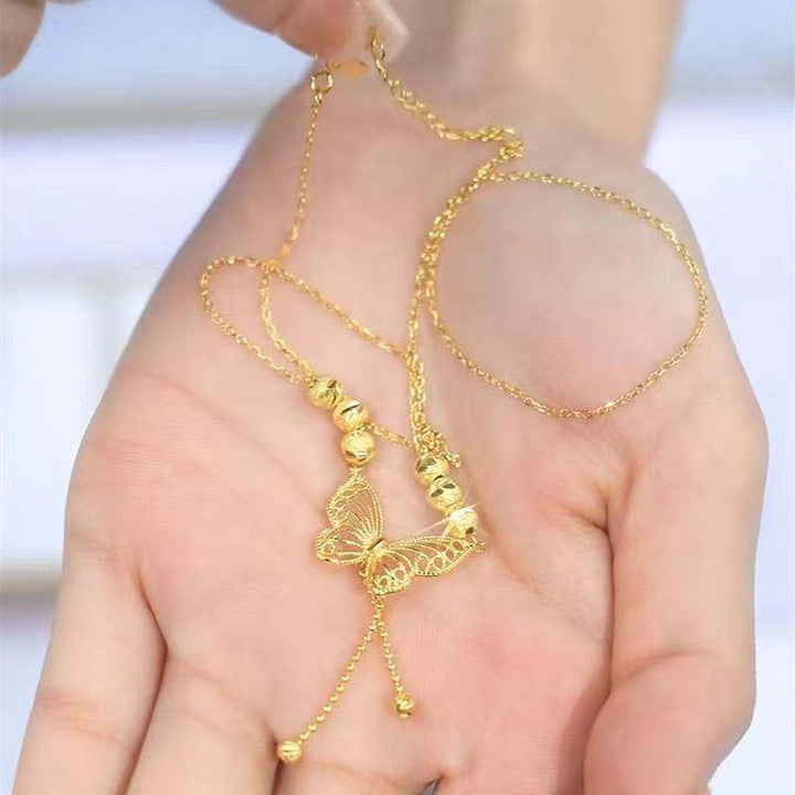 BowLift | Necklace with gold-colored butterfly with tassels