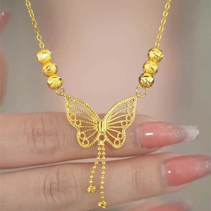 BowLift | Necklace with gold-colored butterfly with tassels