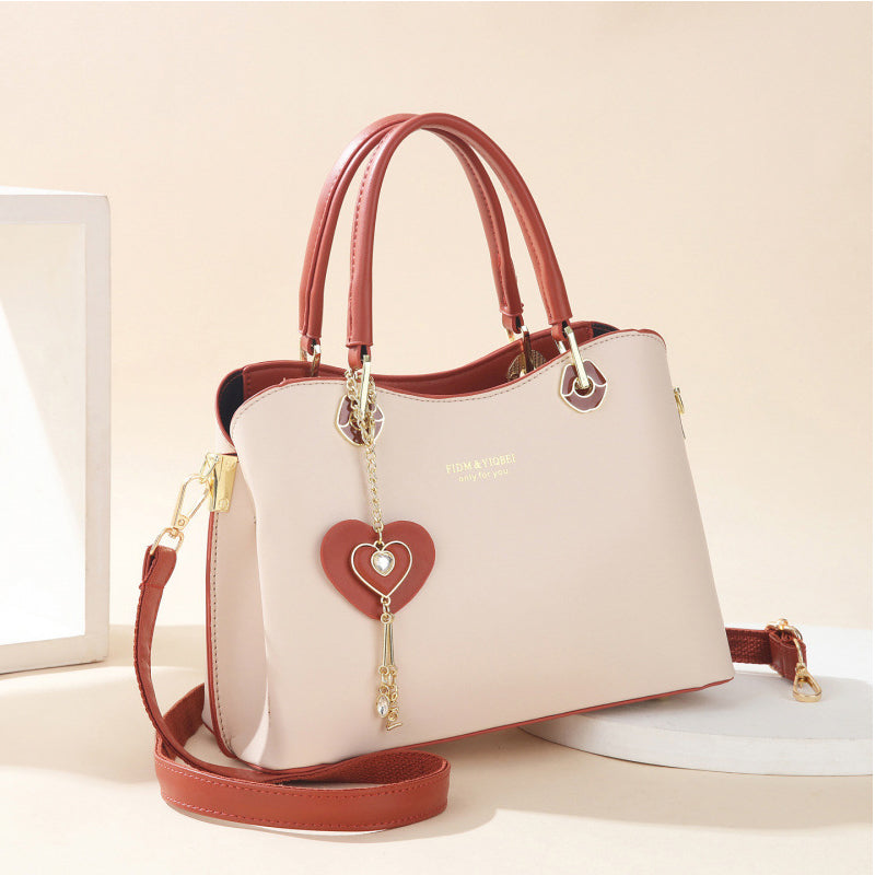 BowLift | Elegant women's handbag with sparkling heart pendant